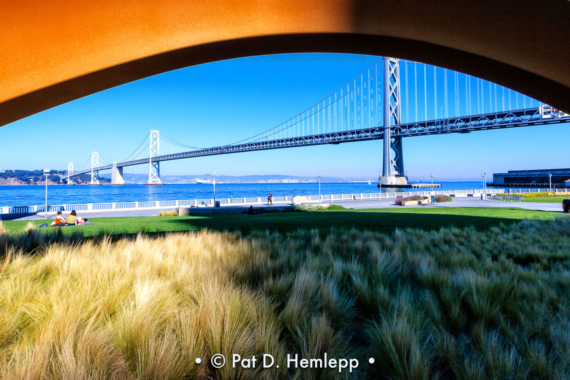 The Bay Bridge can be seen beneath the bow of "Cupid's Span," a sculpture on the Embarcadero in San Francisco.