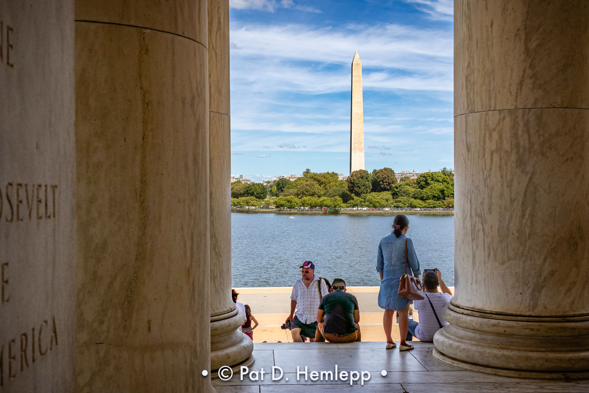 The Washington Monument is bracketed by the columns of the Jefferson Memorial, Washington, D.C.
