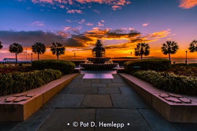 Sunrise behind the Pineapple Fountain in Charleston Waterfront Park, Charleston, S.C.