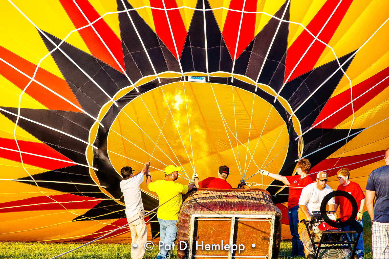 A crew inflates the canopy of a hot-air balloon during a festival in Grove City, Ohio.